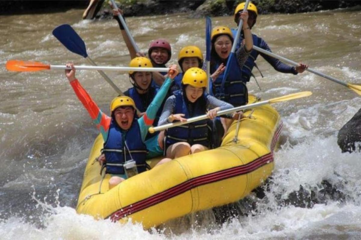 a group of people in a raft on a river