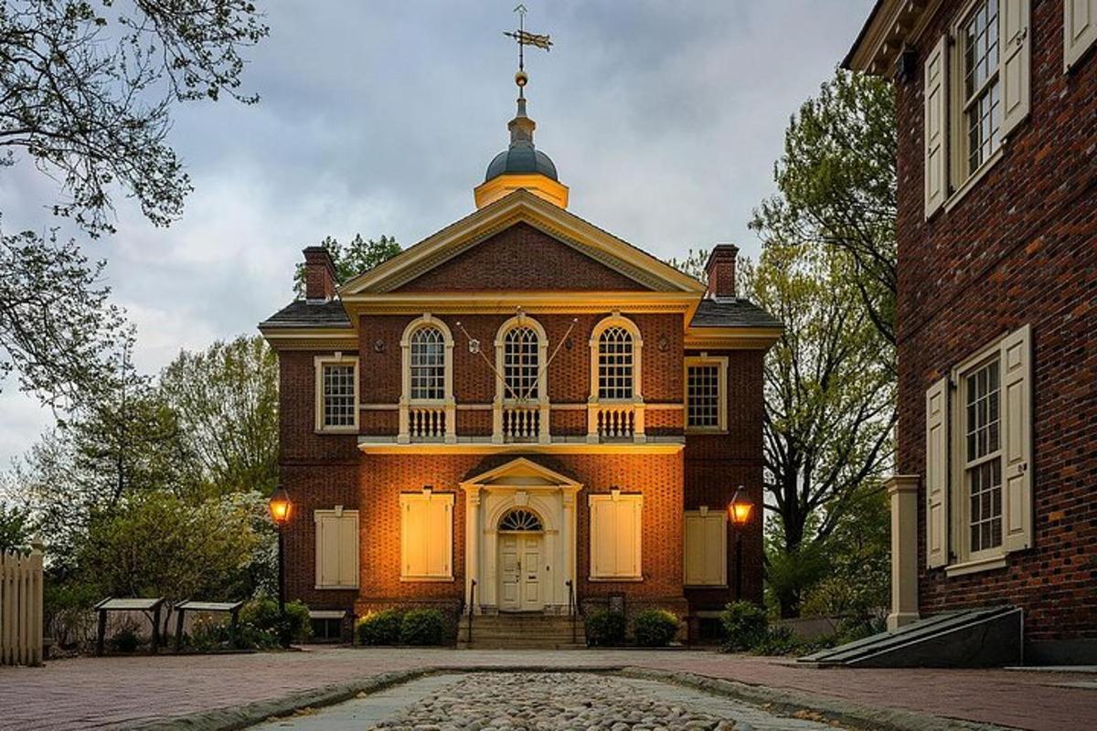 a large brick building with a cross on top of it