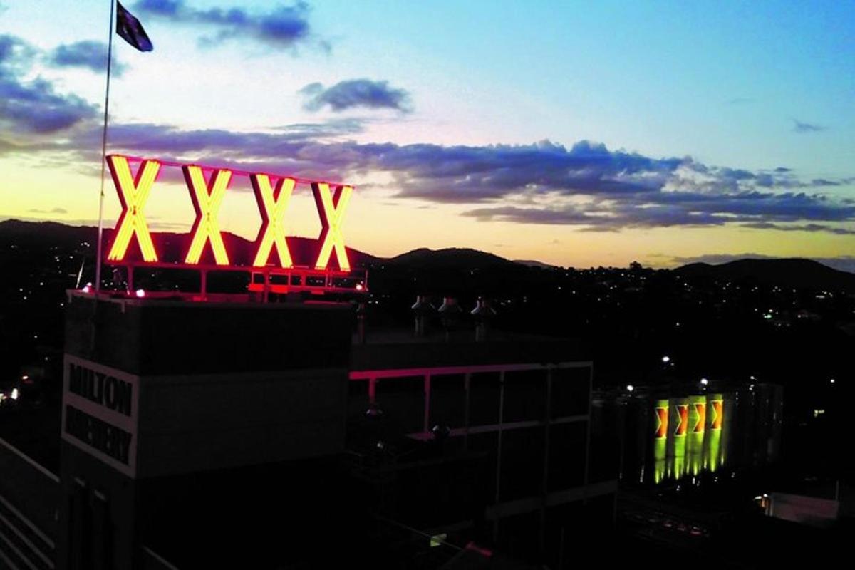a building with a flag on top of it at sunset