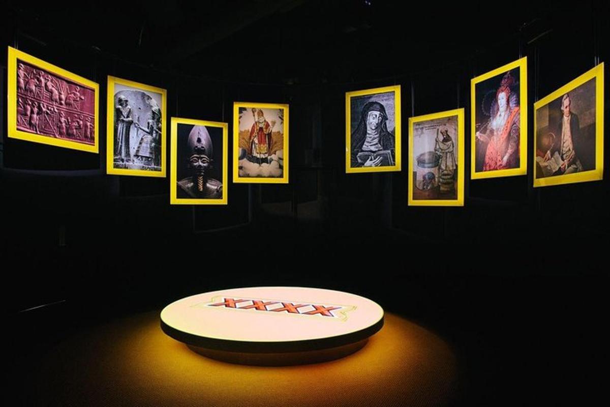 a room with a table with pictures on a wall