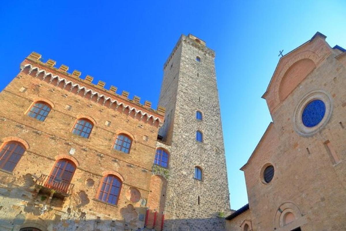 two towers of a building with a blue sky in the background