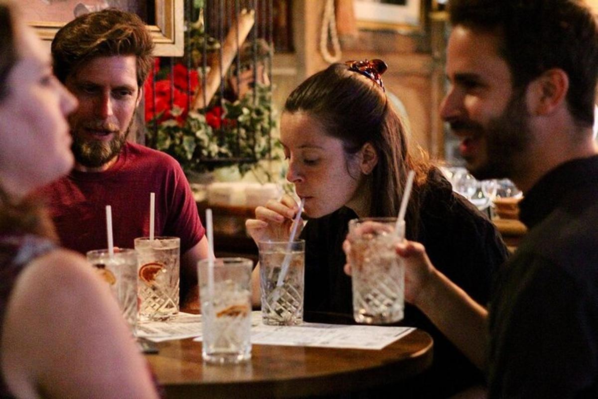 a group of people sitting at a table with drinks