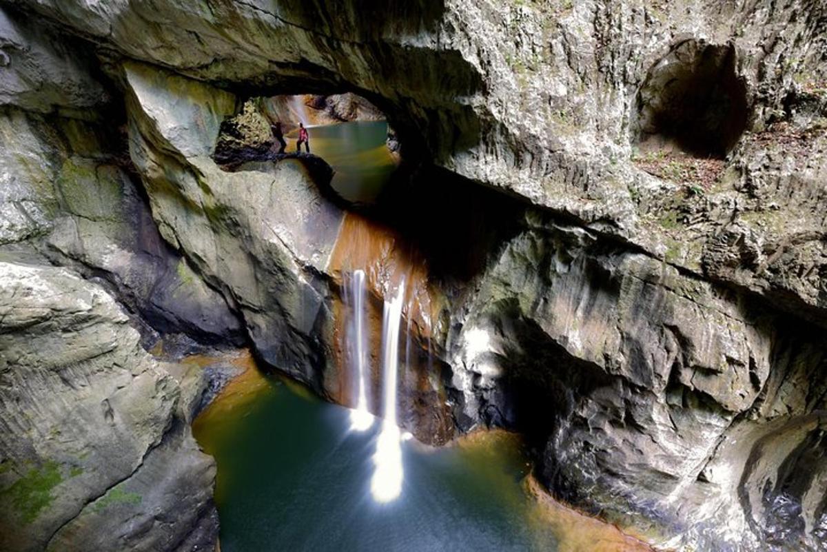 a view of a river through a rock canyon