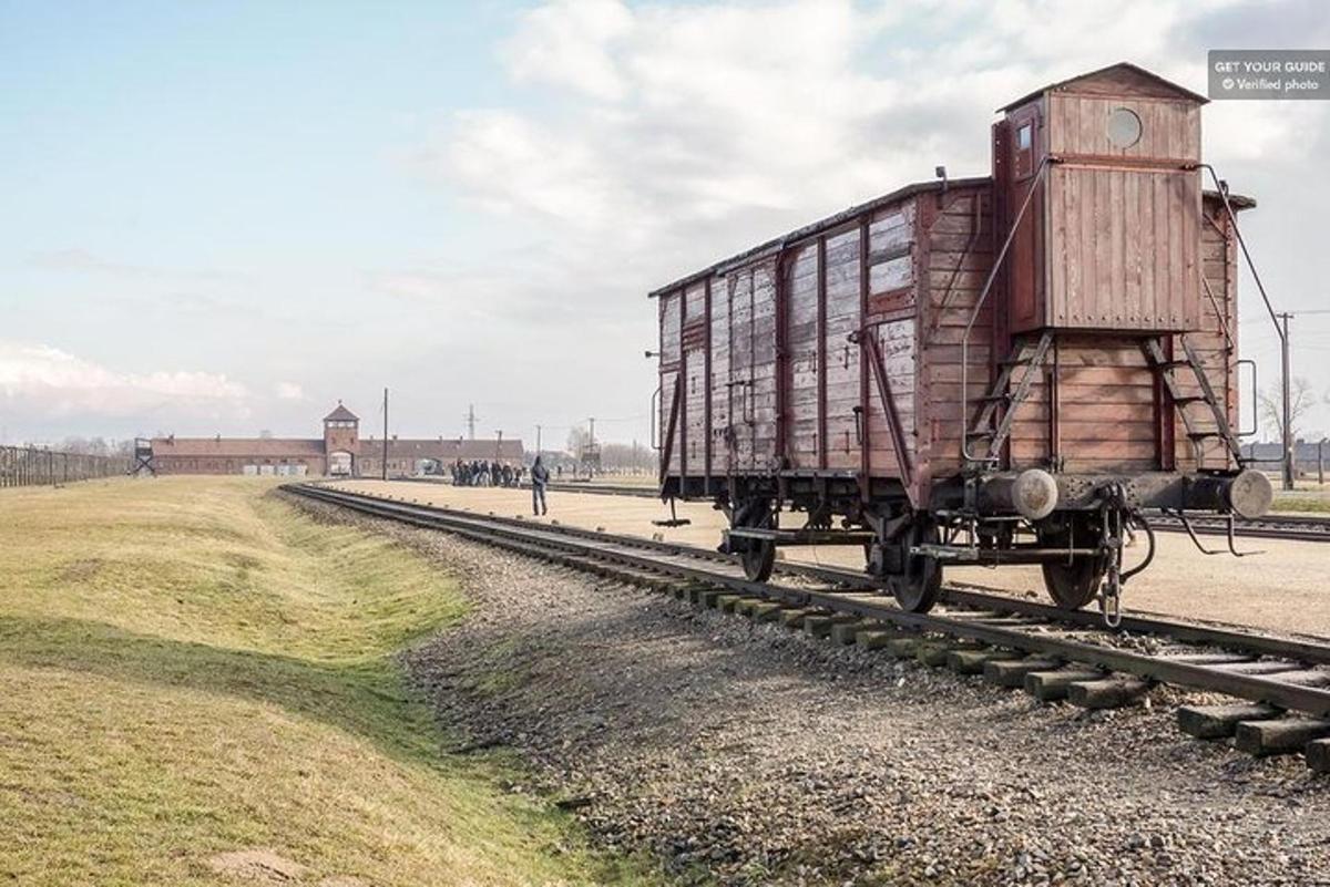 an old train car sitting on the tracks