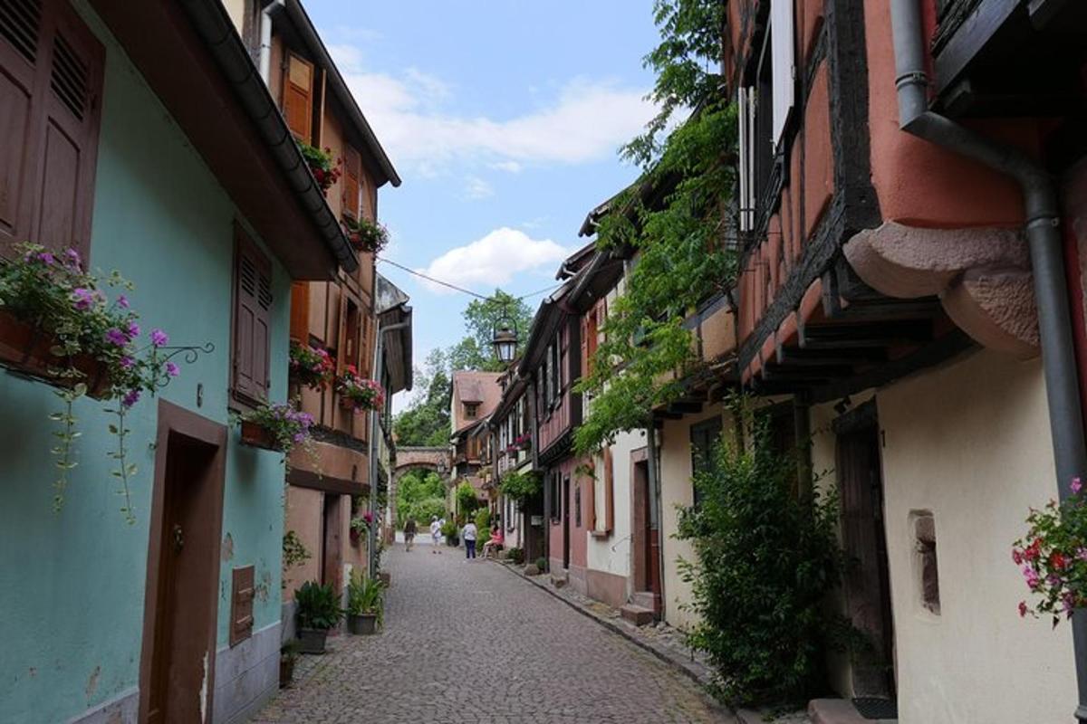 an alley with buildings and a person walking down the street