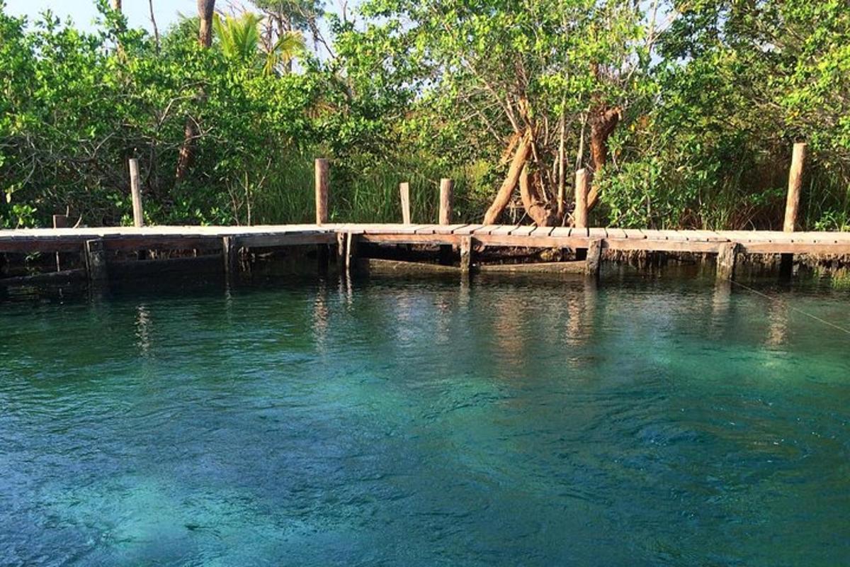 a body of water with a dock in the middle
