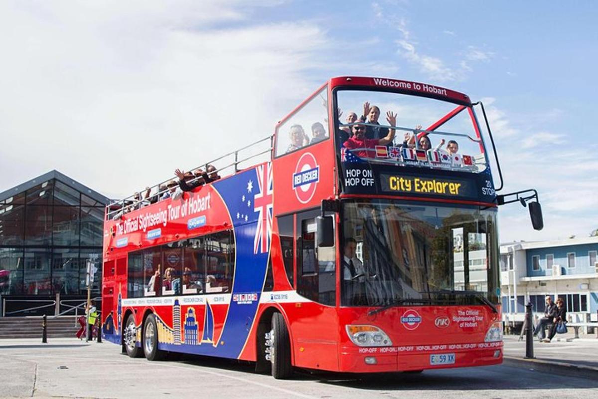 a red double decker bus parked on the street