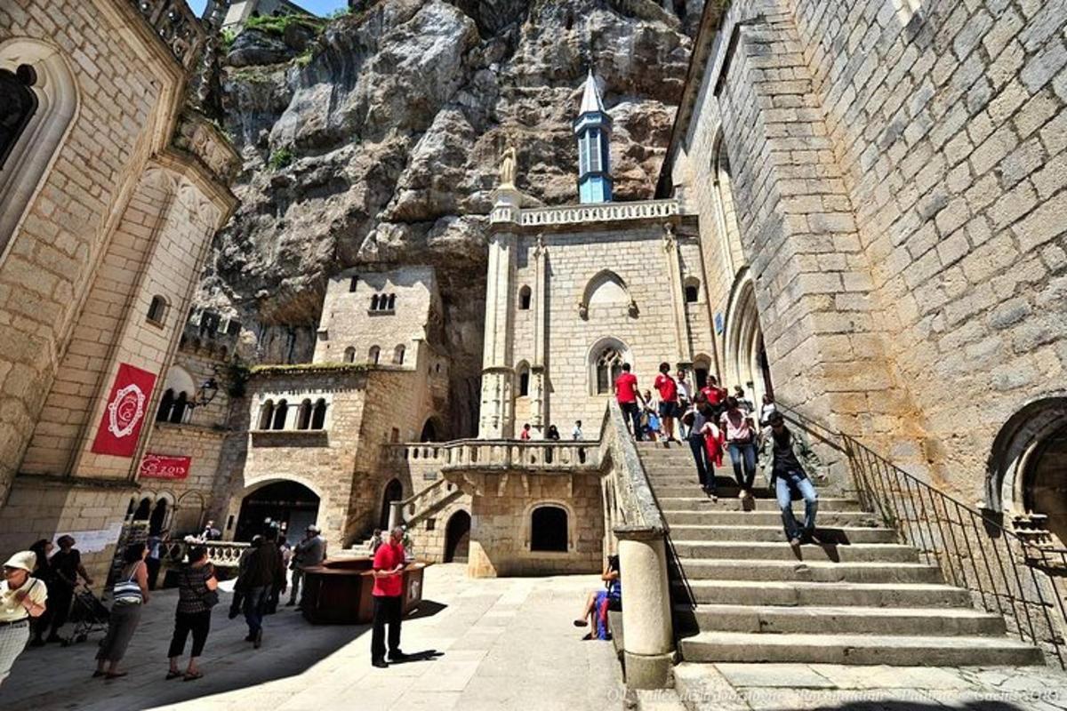 a group of people walking up the stairs of a building