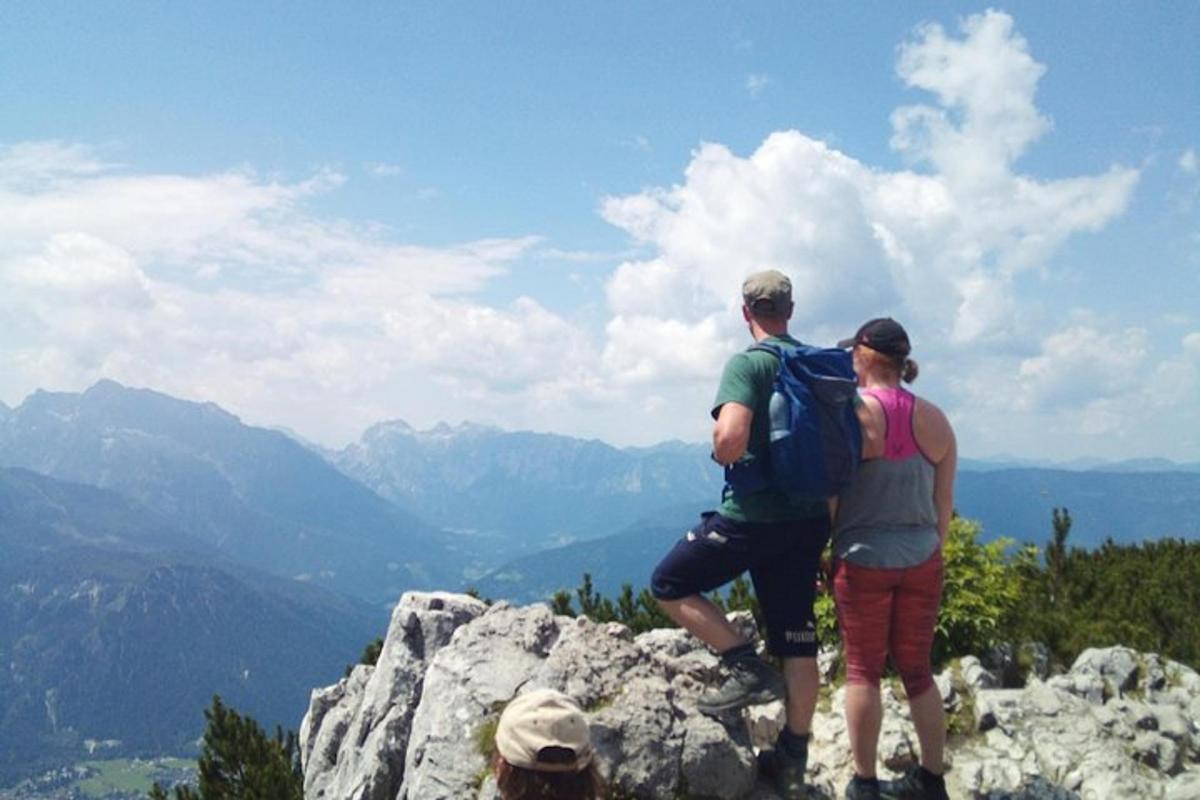 a group of people standing on top of a mountain