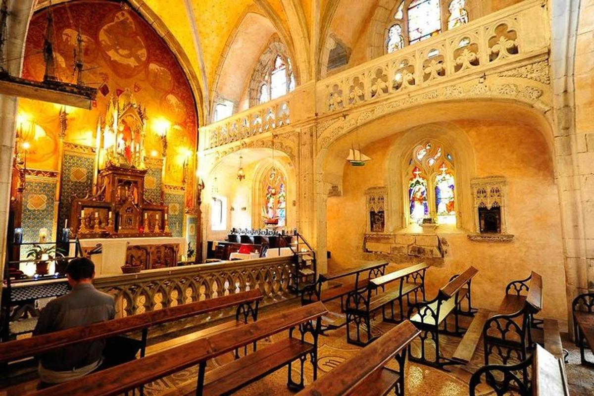 a man is sitting in a church with benches