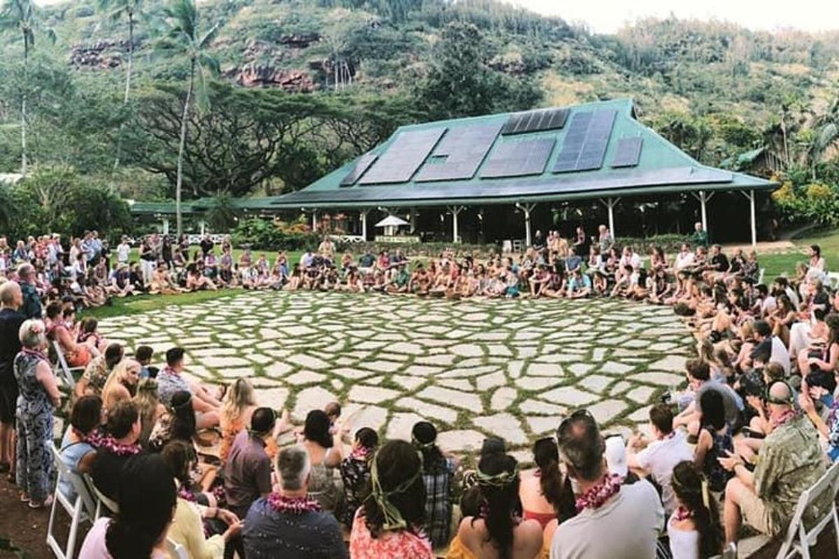 a crowd of people sitting in front of a concert