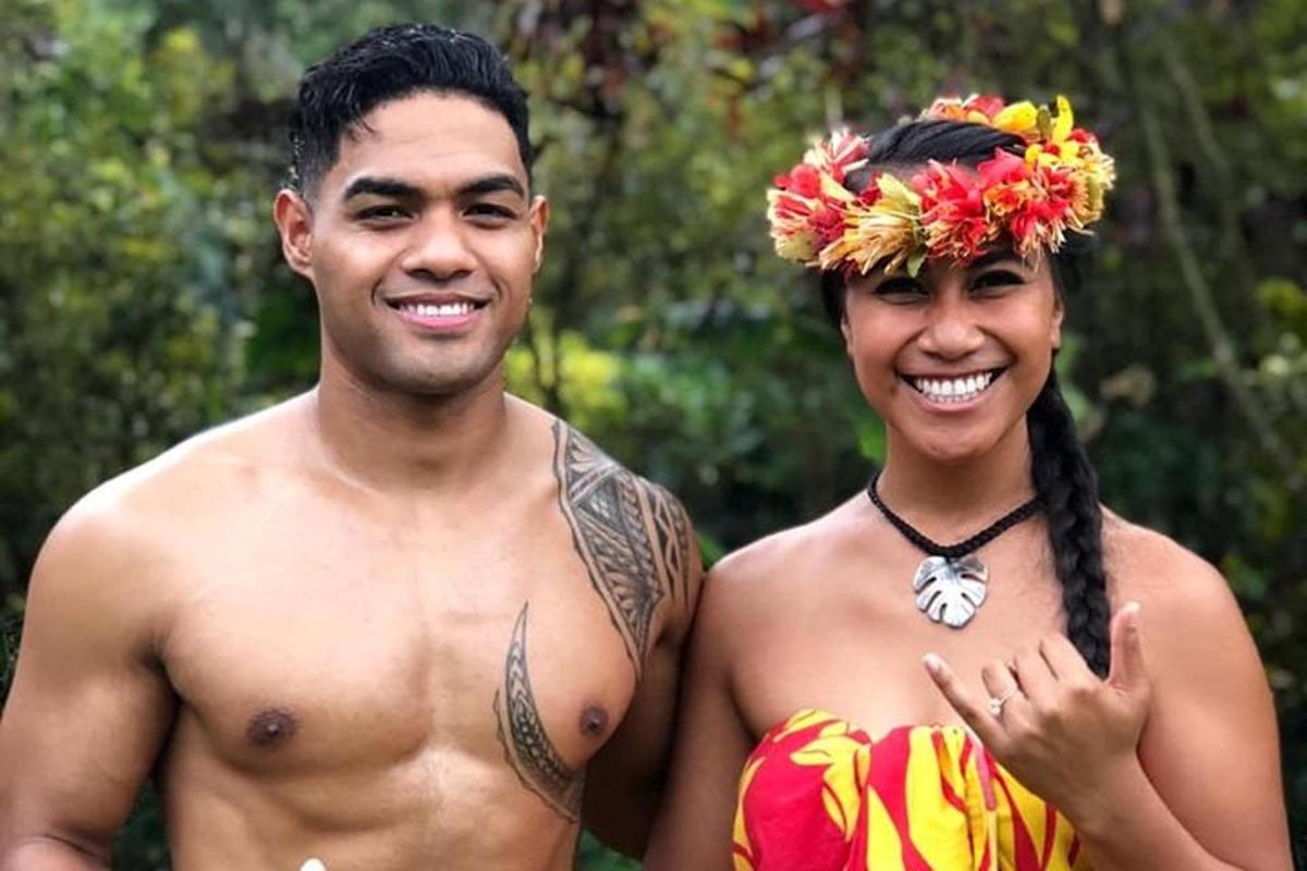 a man and a woman standing next to each other