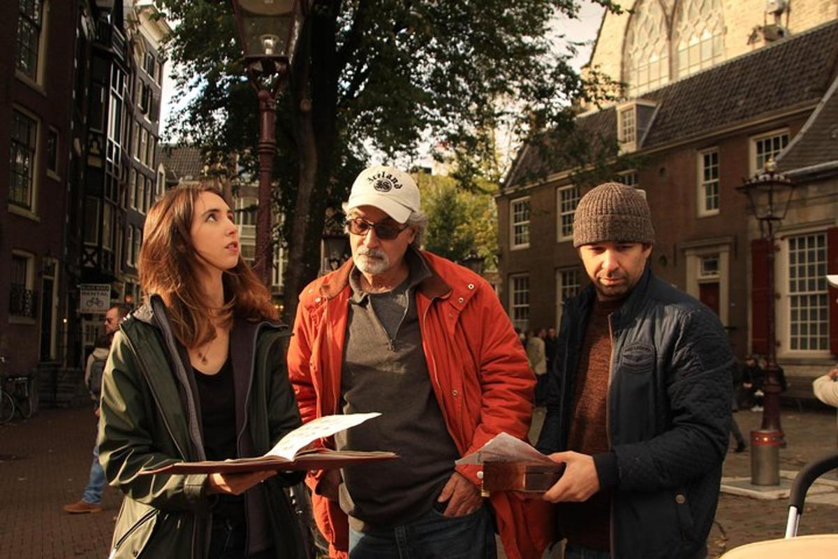 a group of three people standing on a street