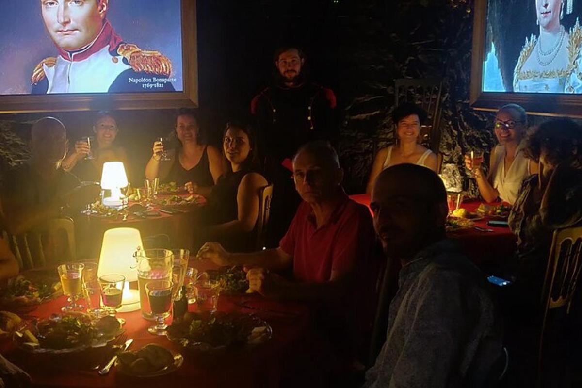 a group of people sitting around a table in a restaurant