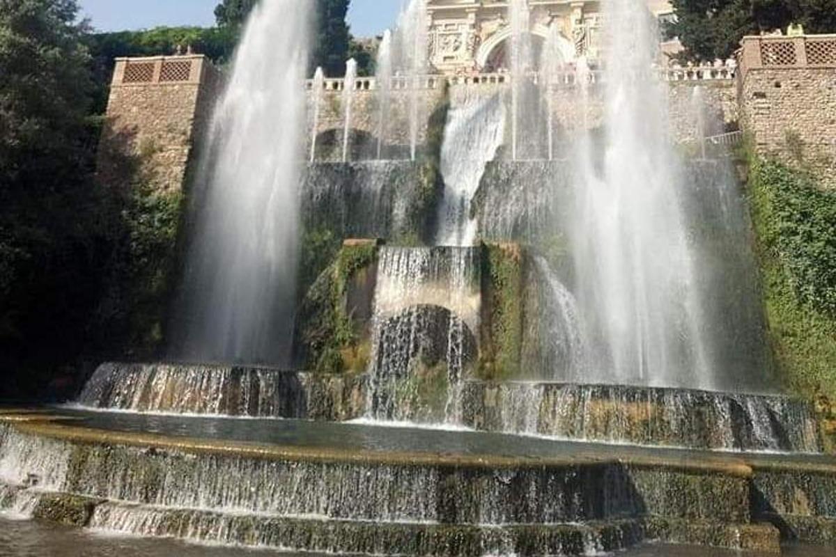 a water fountain in front of a building