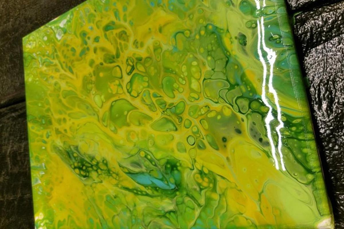 a close up of a painting of a yellow and green