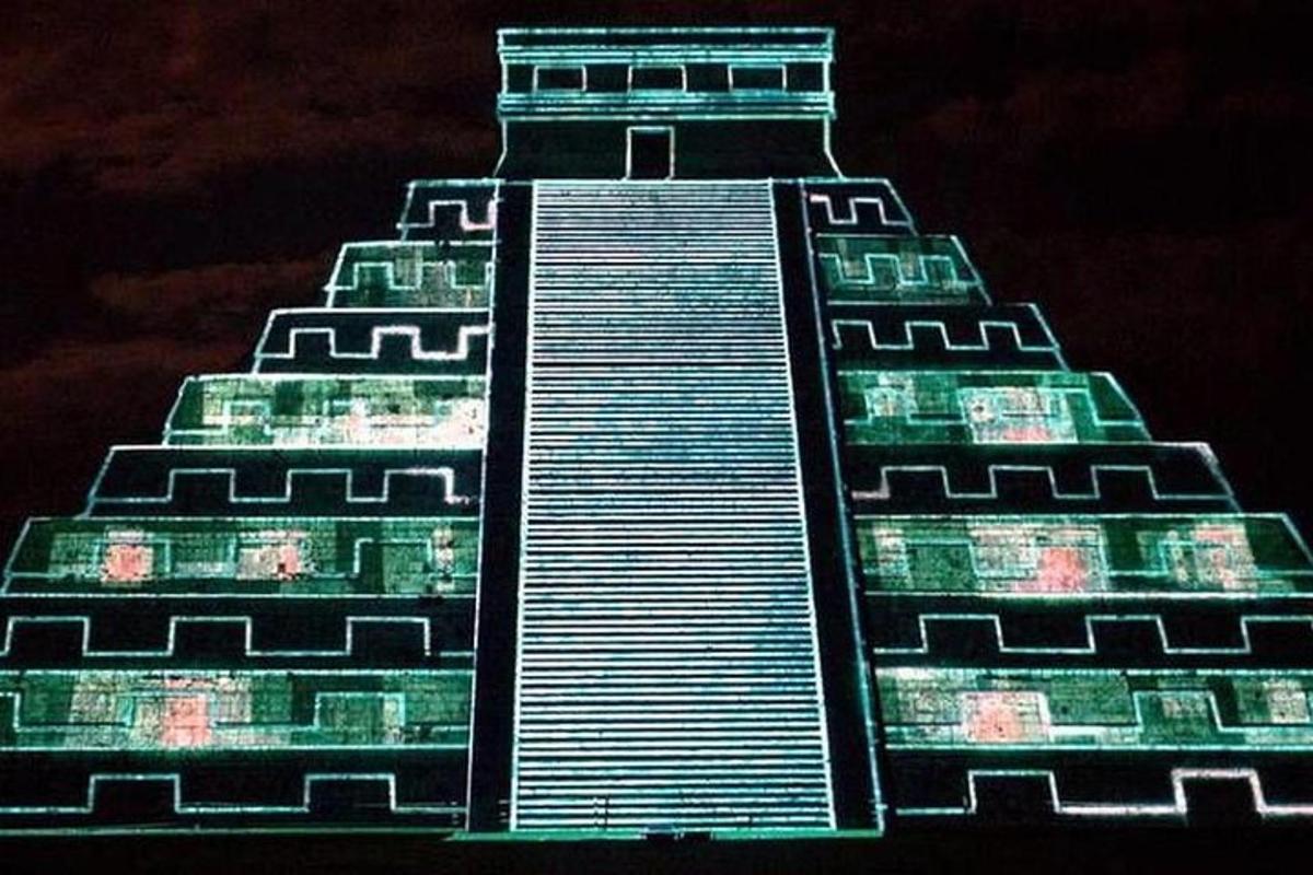 a tall building lit up at night
