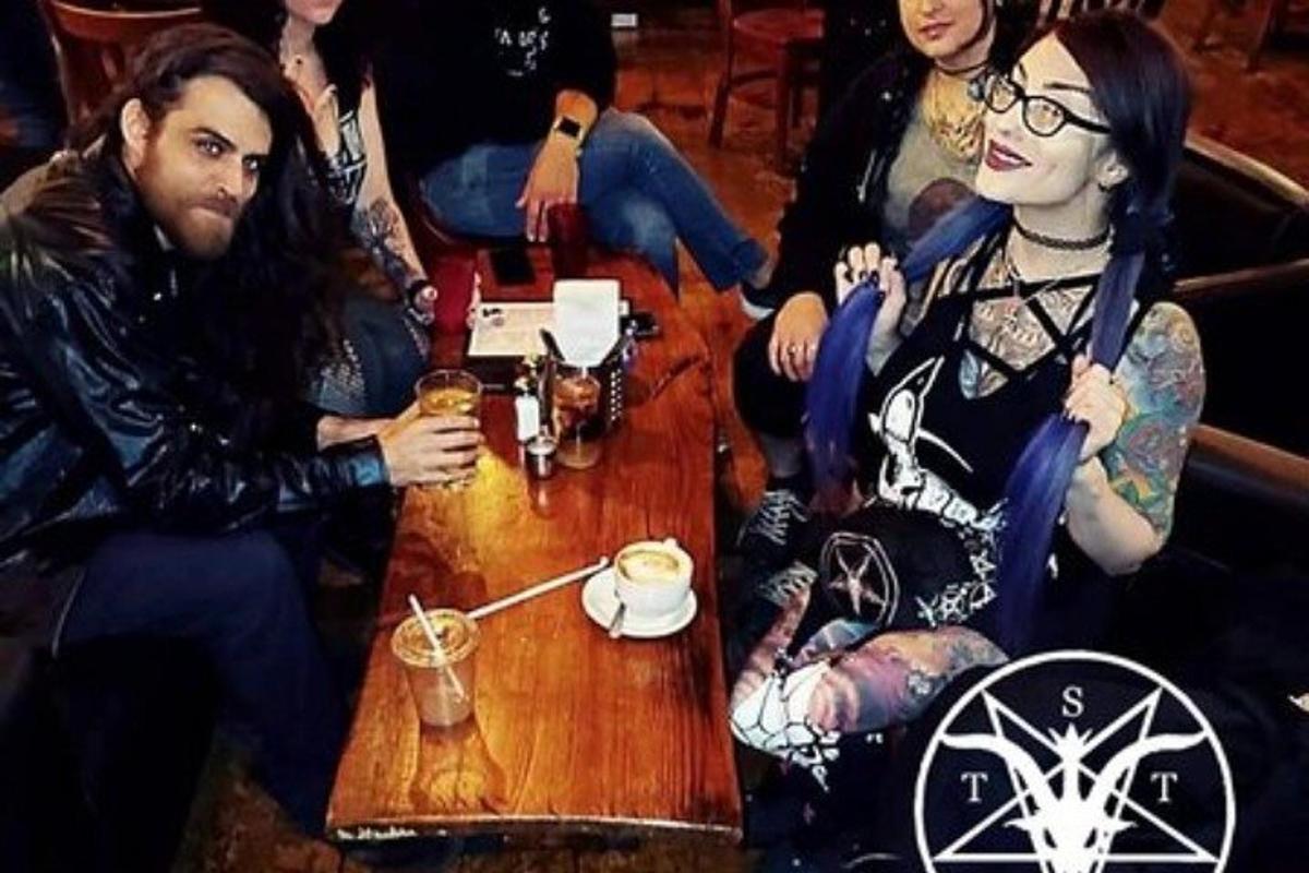 a group of people sitting around a table