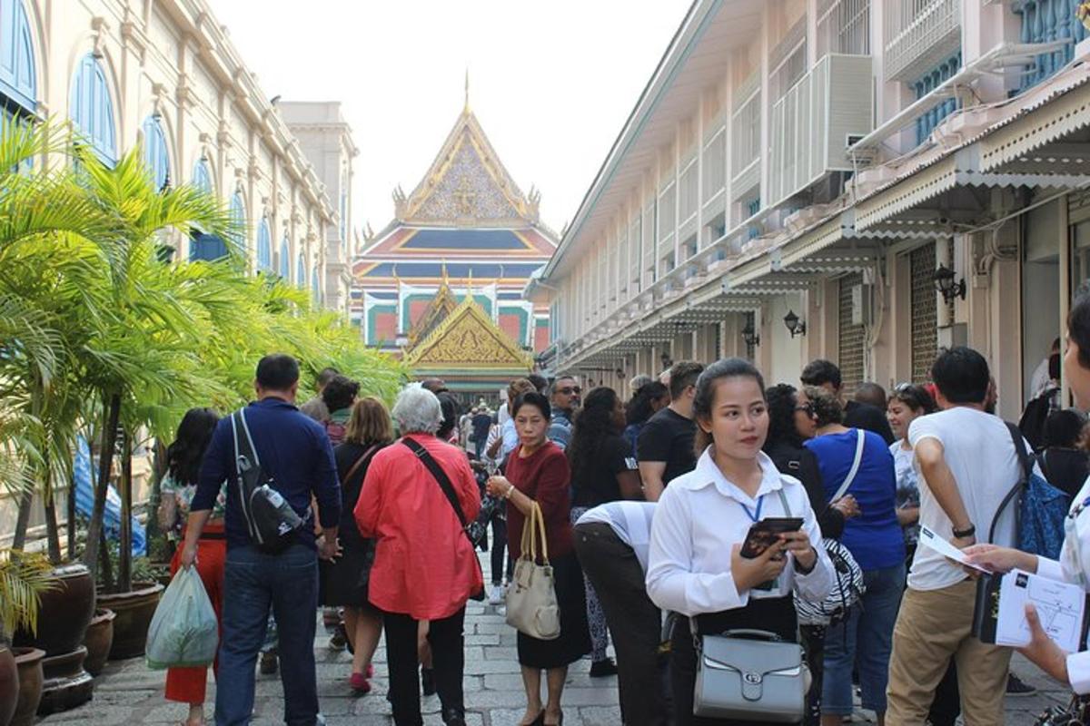 a group of people standing in a crowd in a building