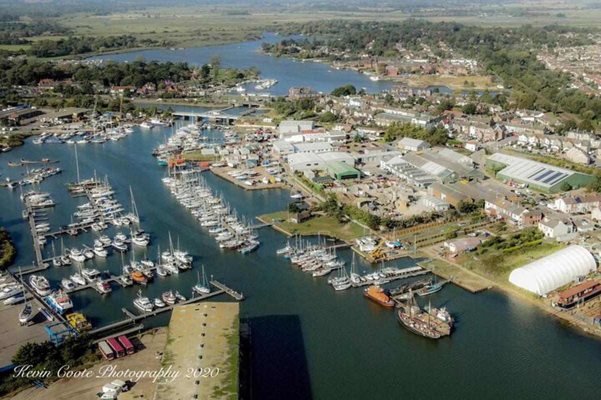 an aerial view of a harbor with boats in the water