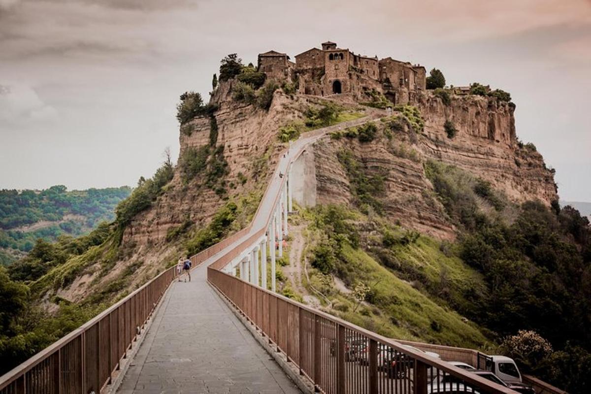 a bridge with a castle on top of a mountain