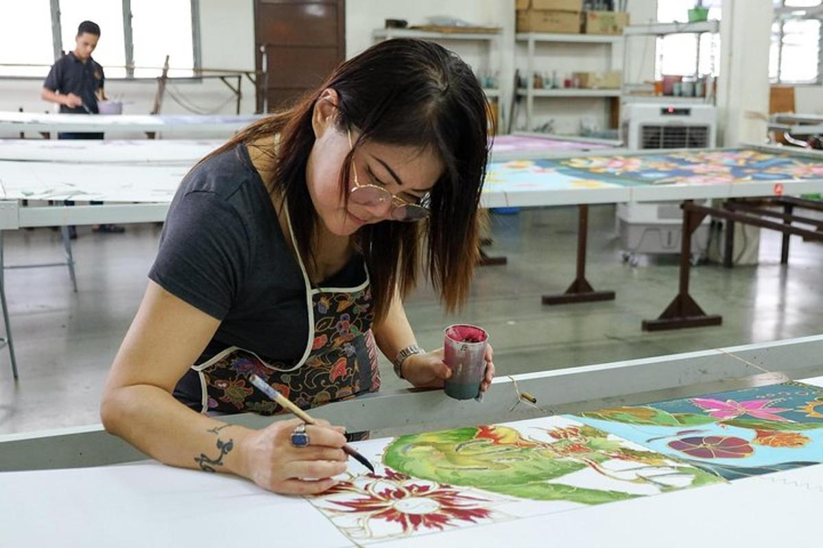 a woman working on a painting on a table