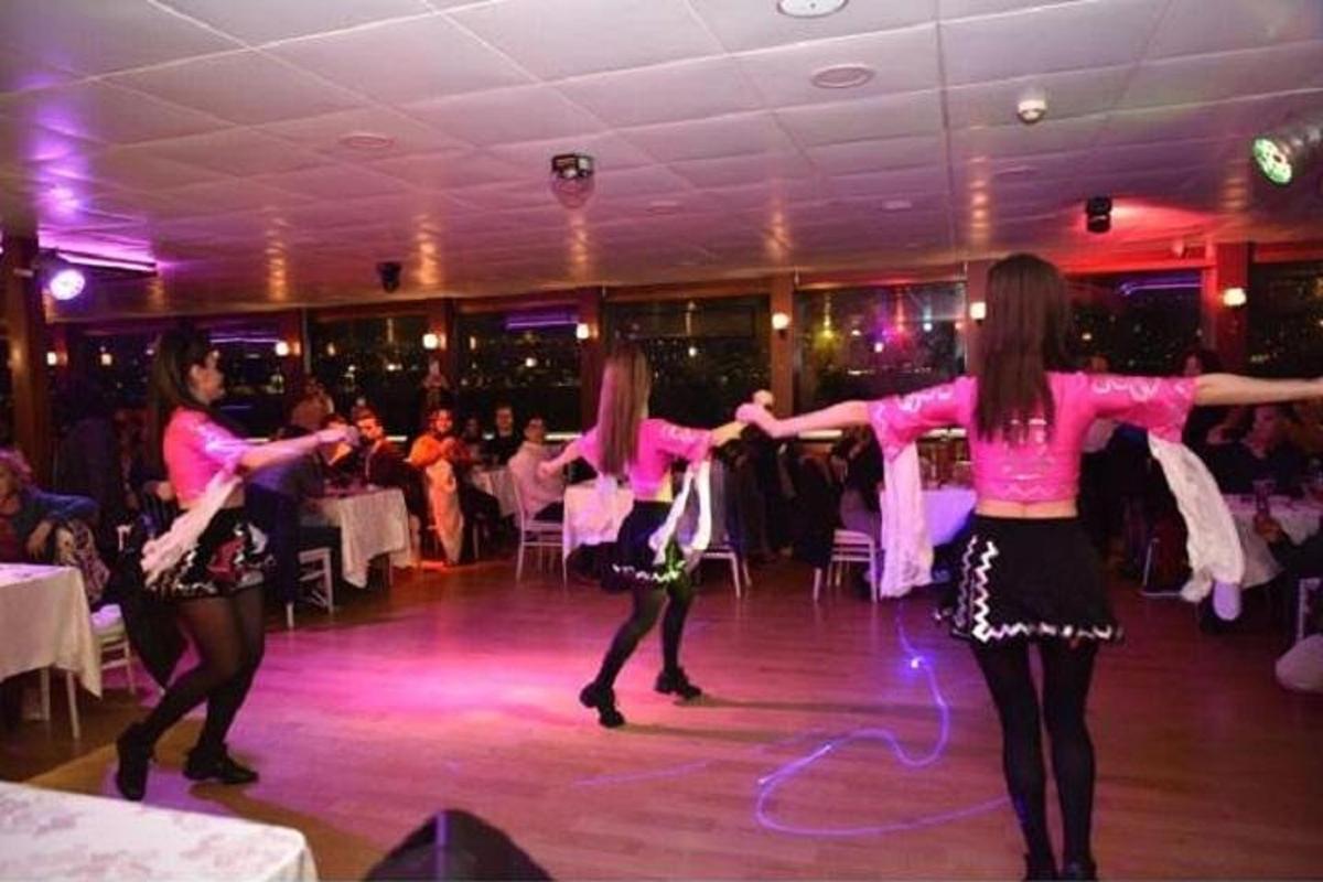 three girls dancing on a dance floor at a party