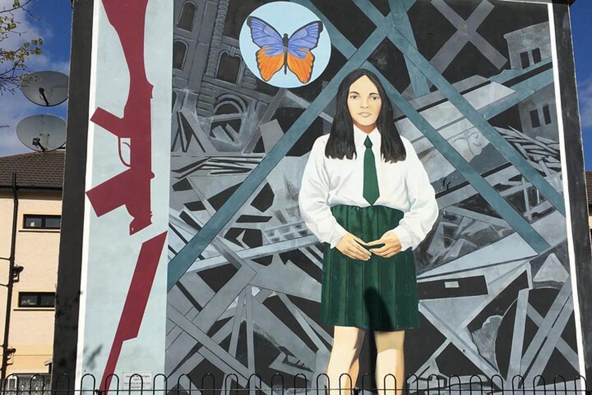 a mural of a girl with a butterfly on a wall