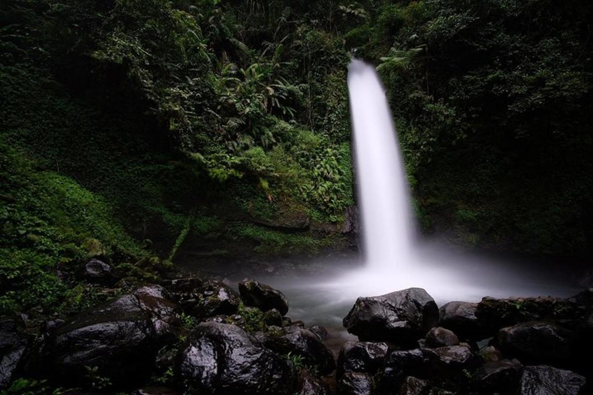 a waterfall in the middle of a river