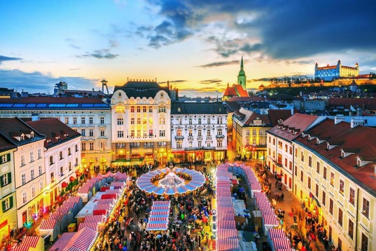 an overhead view of a market in a city at sunset