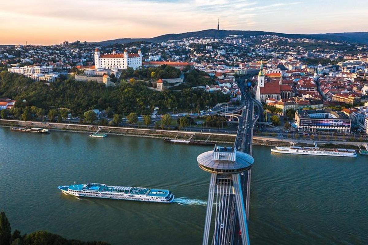 a bridge over a river with a boat in the water