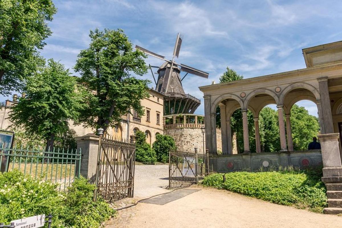 a building with a gate and a windmill