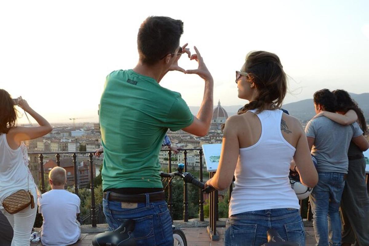 a group of people looking at the city