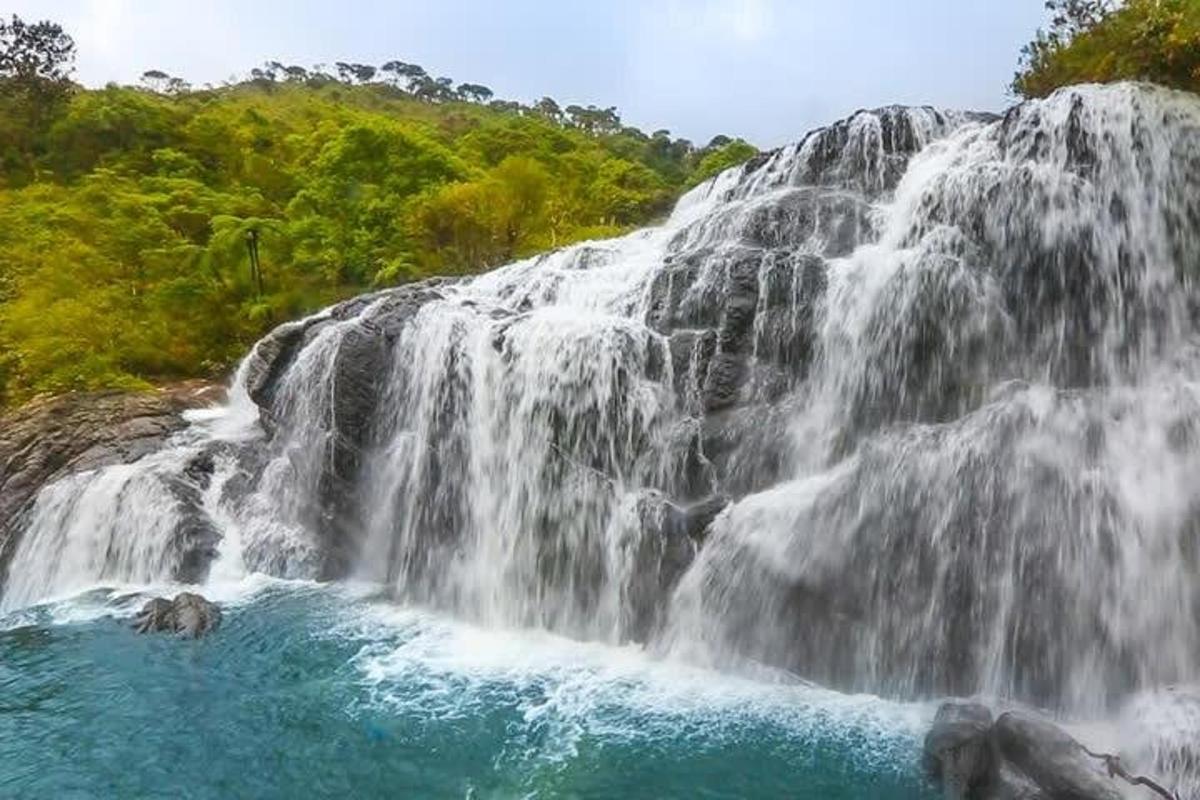 a waterfall with water rushing over the rocks