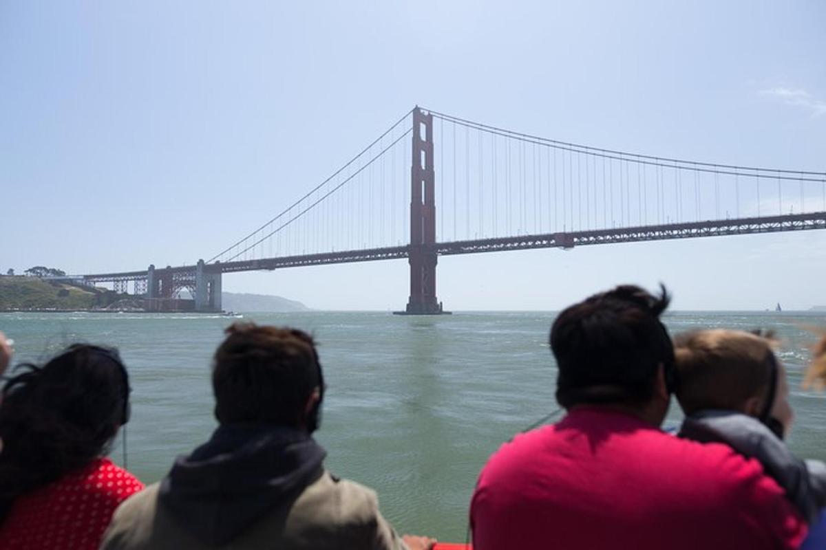 a group of people looking out at a bridge