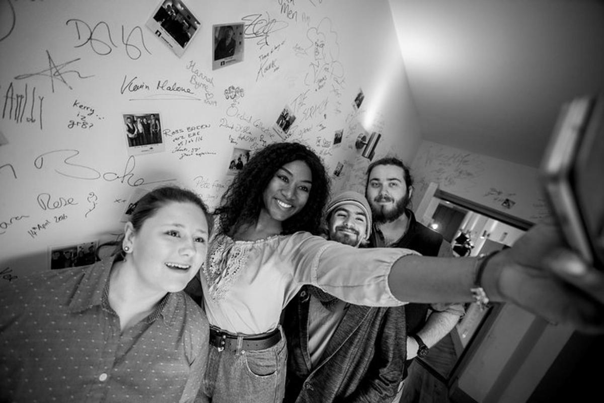 a group of people posing for a picture in a room