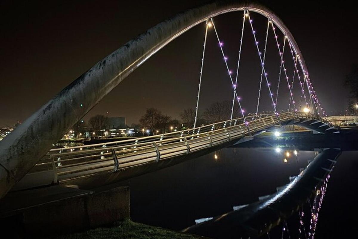 a bridge over the water at night with lights