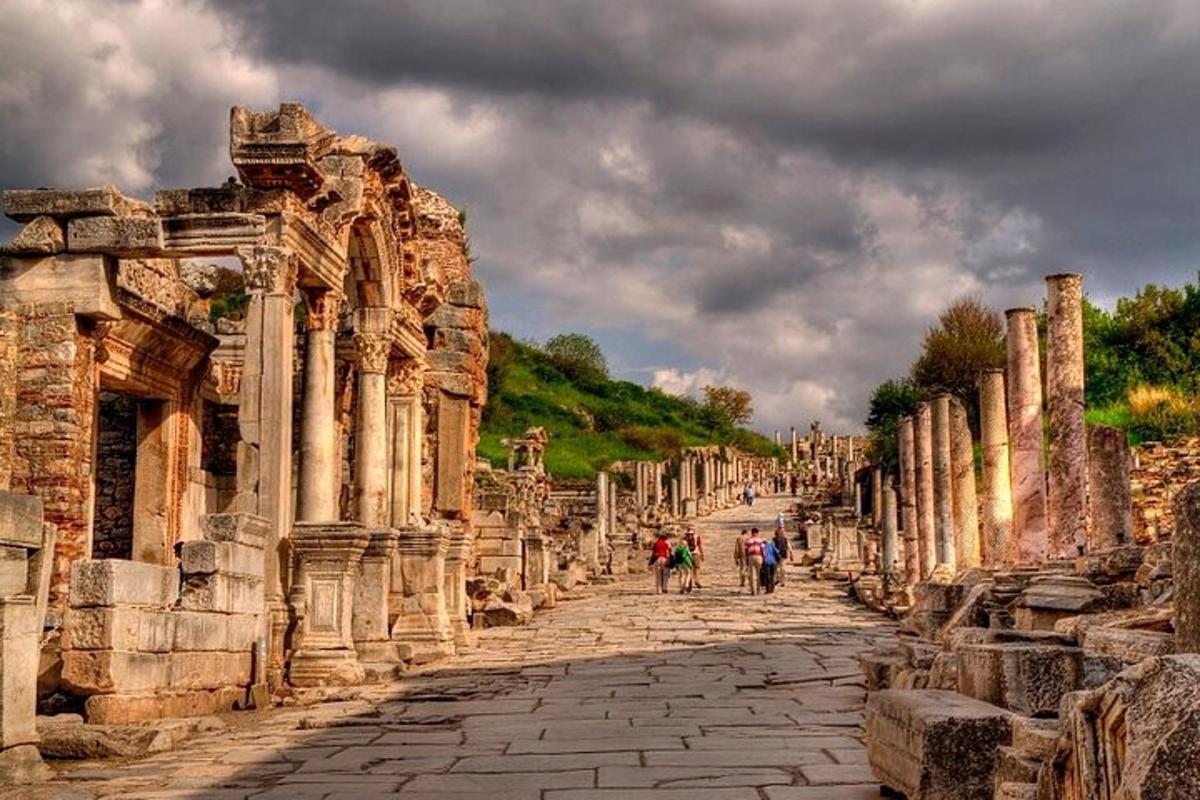 a group of people walking down a street in the ruins