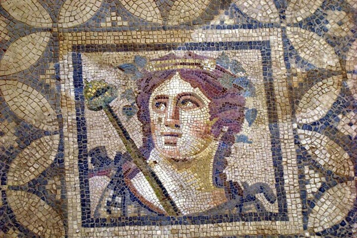 a mosaic of a woman with a spear in her mouth