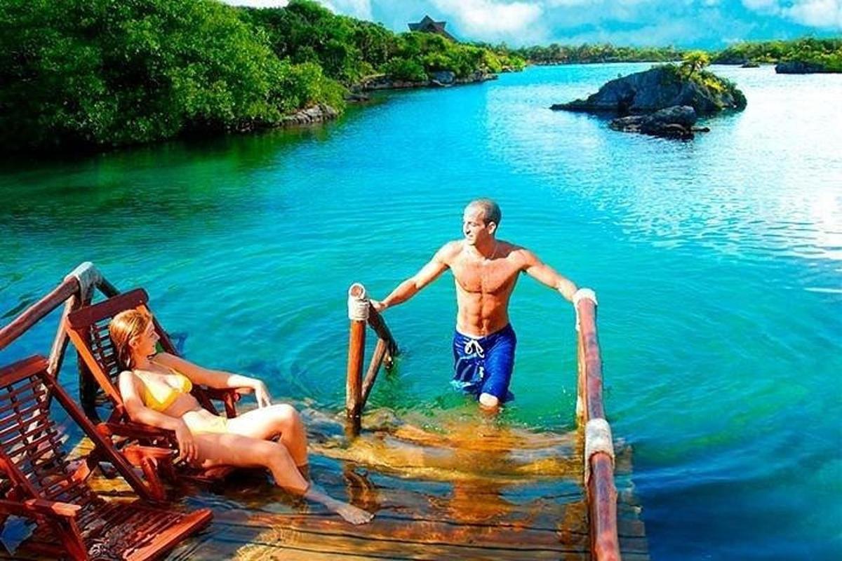 a man and a woman in the water on a raft