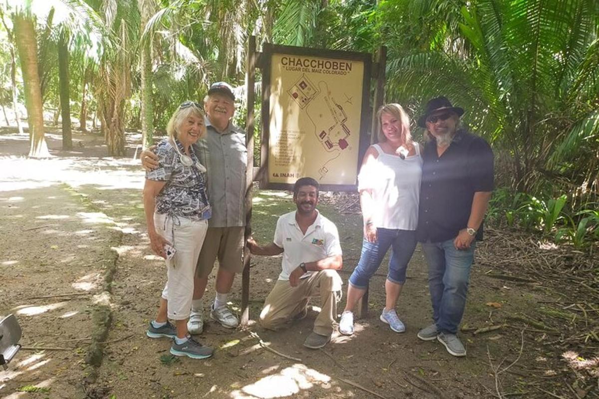 a group of people standing in front of a sign