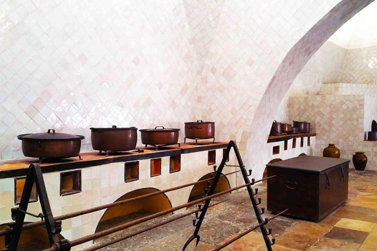 a kitchen with pots and pans on a table