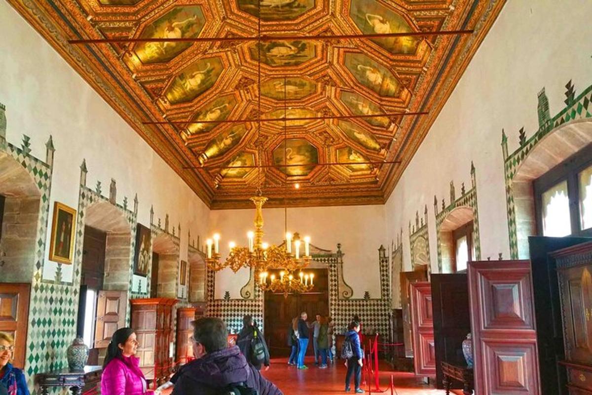 a large room with a ceiling with a chandelier