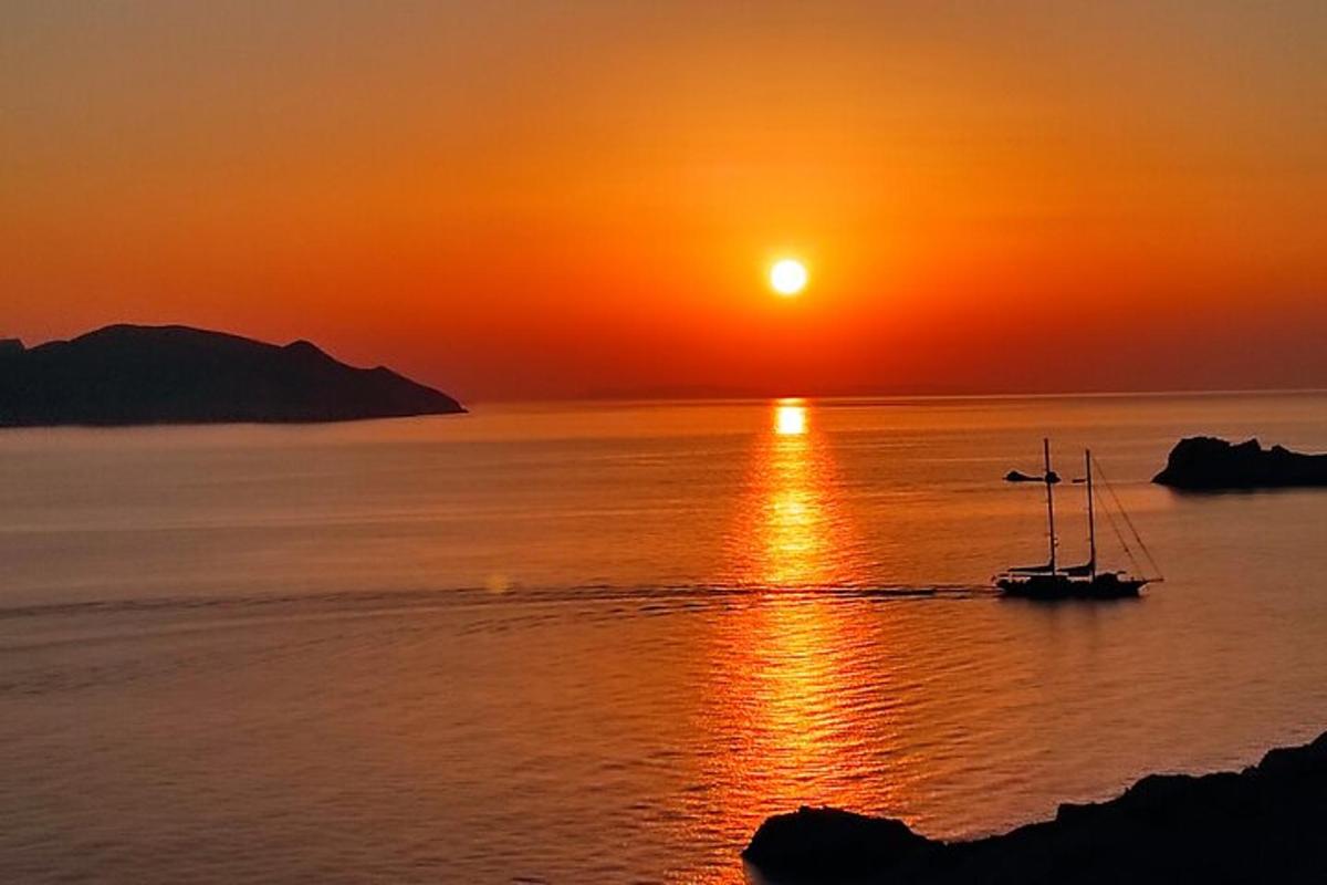 a boat in the water at sunset