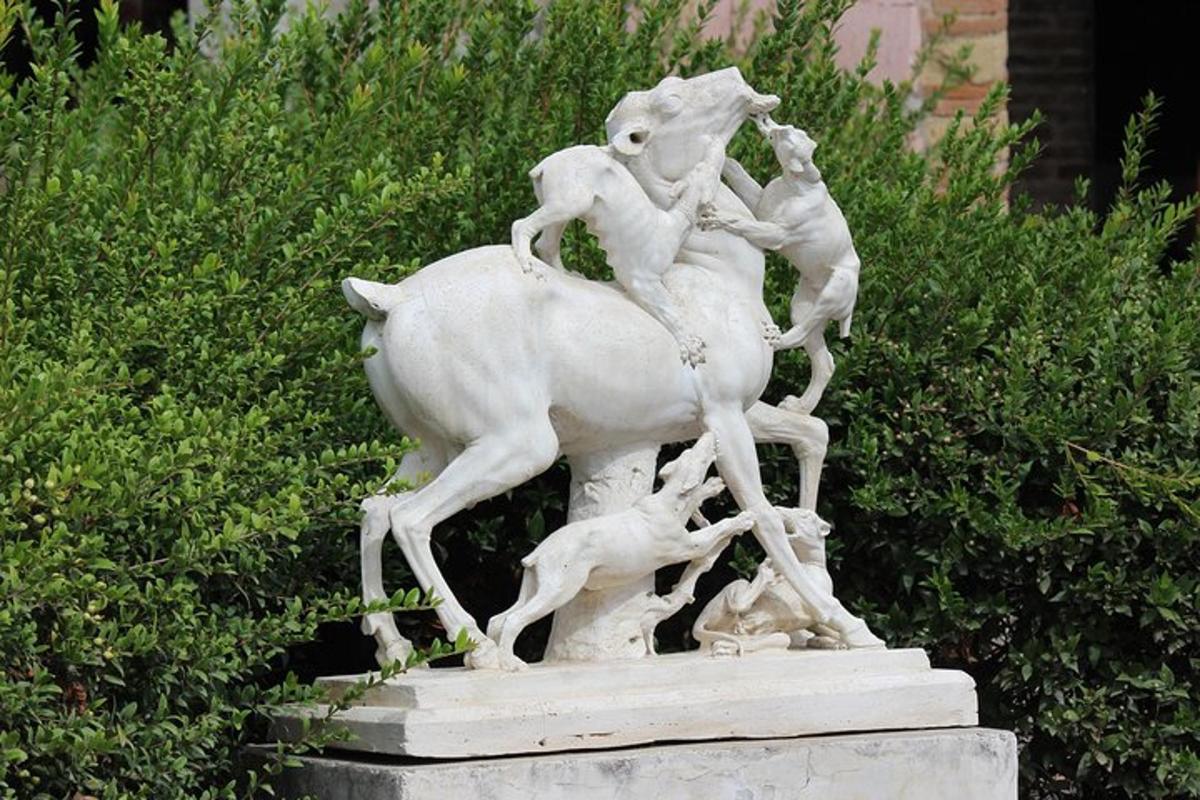 a statue of a woman riding a bull