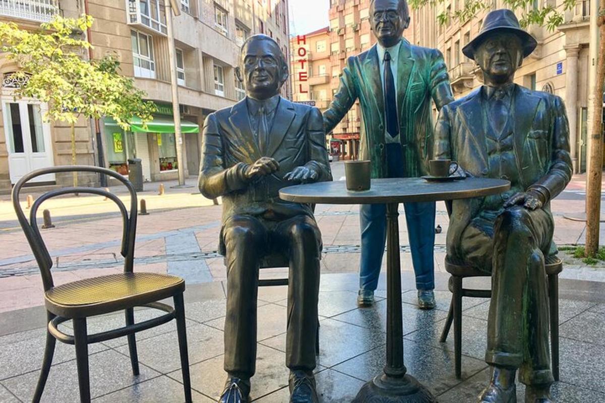 a statue of three men sitting at a table