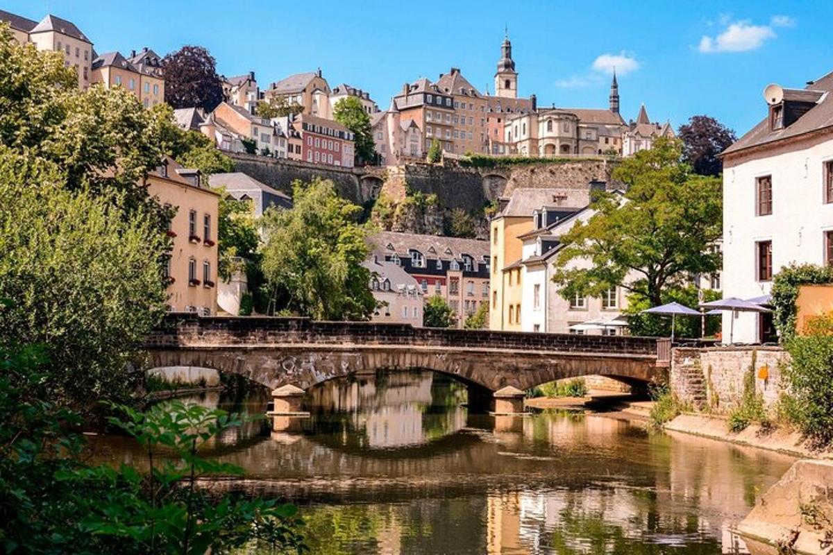 a bridge over a river in a city with buildings