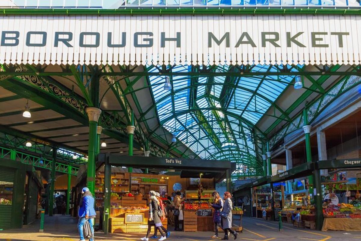 a market with people walking inside of a building