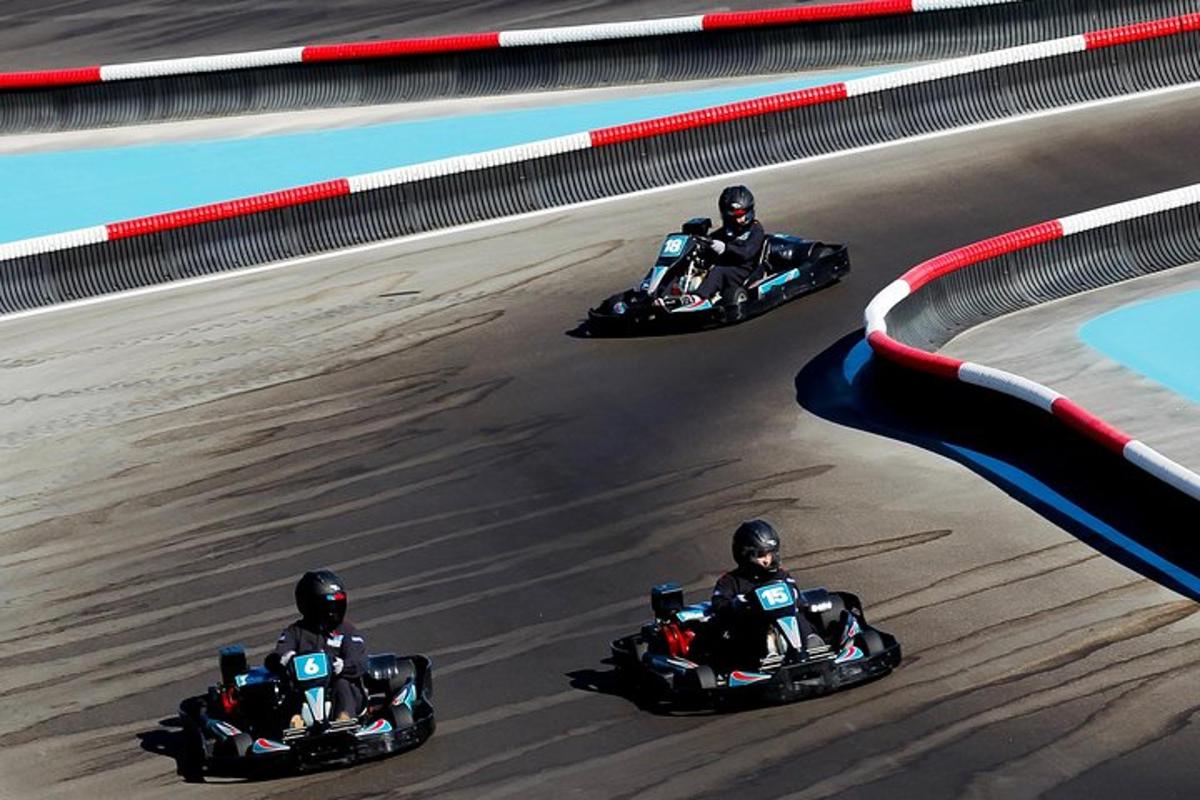 three motorcyclists racing on a race track