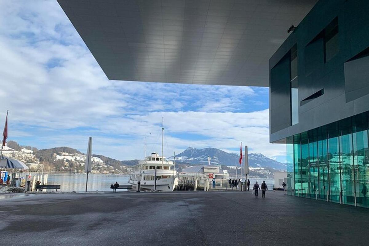 a boat is docked next to a large building